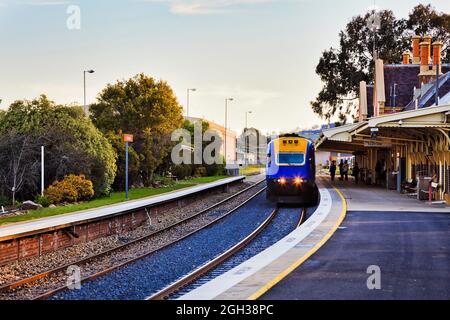 Intercity passenger train arraving at platform of railway station in Bathurst town of rural Australia. Stock Photo