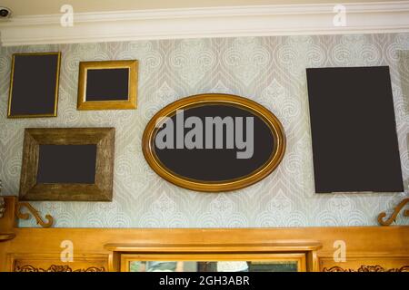 A wall with empty frames for pictures and photos. Interior of the restaurant, apartment building. Stock Photo