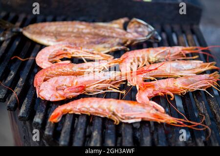 Shrimp on the grill. Large royal prawns on the grill Stock Photo