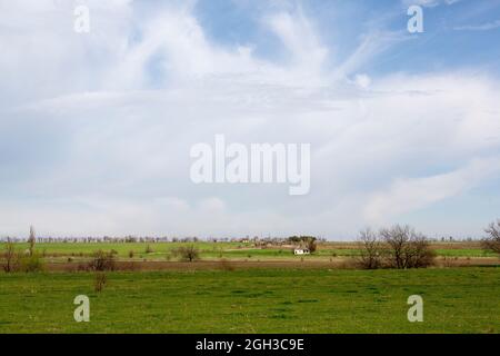 Beautiful lonely house in the field Stock Photo