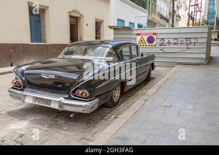 HAVANA, CUBA - May 29, 2019: A view of a black classic car parked in Havana Stock Photo