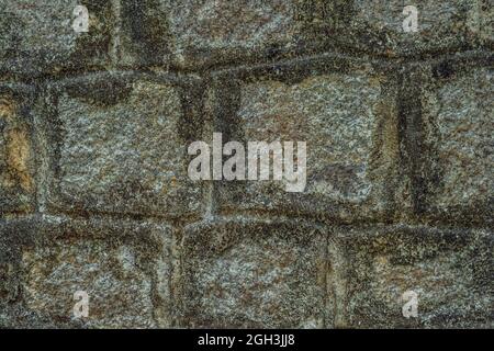 Old Temple wall. Rectangular cut out marble granite brick real surface stone with cement. Pattern gray color rustic texture background. Design website Stock Photo