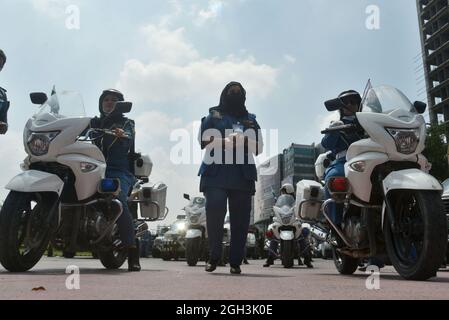 Lahore, Pakistan. 04th Sep, 2021. Pakistani traffic police women ride their motorbikes and others take a part during the women safety and empowerment march rally in Lahore. Punjab Police launches a women safety app and anti women harassment cell help line no 1242. (Photo by Hussain Ali/Pacific Press) Credit: Pacific Press Media Production Corp./Alamy Live News Stock Photo