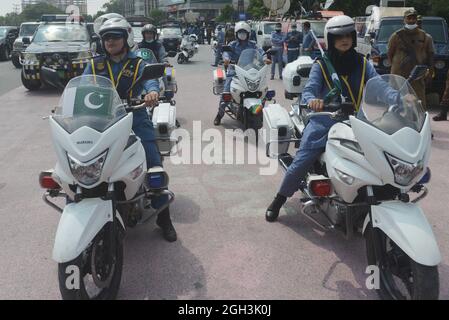 Lahore, Pakistan. 04th Sep, 2021. Pakistani traffic police women ride their motorbikes and others take a part during the women safety and empowerment march rally in Lahore. Punjab Police launches a women safety app and anti women harassment cell help line no 1242. (Photo by Hussain Ali/Pacific Press) Credit: Pacific Press Media Production Corp./Alamy Live News Stock Photo