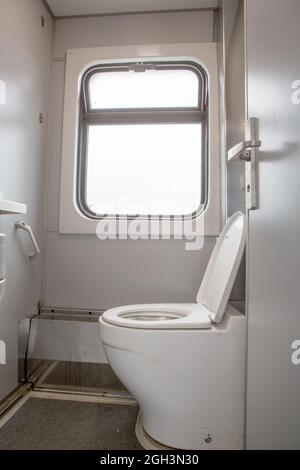 Classic toilet interior on the train. Toilet in the passenger train Stock Photo