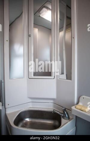 Classic toilet interior on the train. Toilet in the passenger train Stock Photo