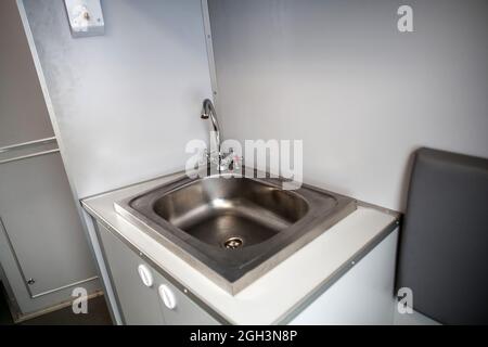 Classic toilet interior on the train. Toilet in the passenger train Stock Photo