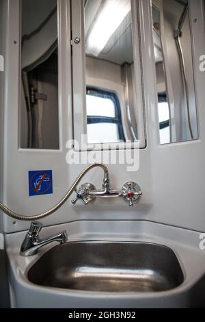 Classic toilet interior on the train. Toilet in the passenger train Stock Photo