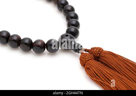 Buddhist rosary called Juzu. Buddhist tool used for praying at funeral Stock Photo