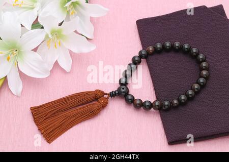 Buddhist rosary called Juzu. Buddhist tool used for praying at funeral Stock Photo