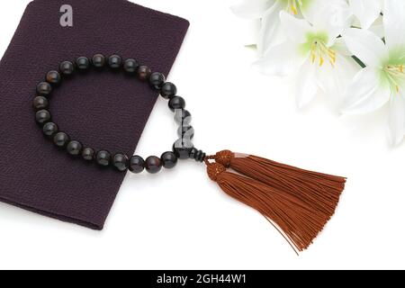 Buddhist rosary called Juzu. Buddhist tool used for praying at funeral Stock Photo