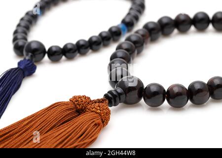 Buddhist rosary called Juzu. Buddhist tool used for praying at funeral Stock Photo