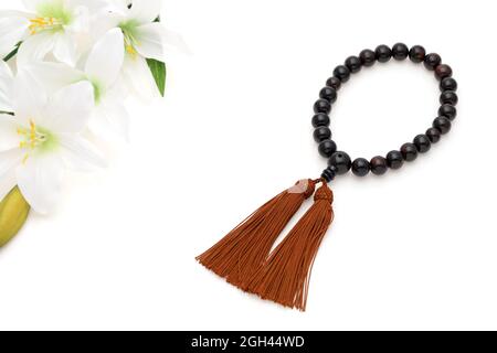 Buddhist rosary called Juzu. Buddhist tool used for praying at funeral Stock Photo