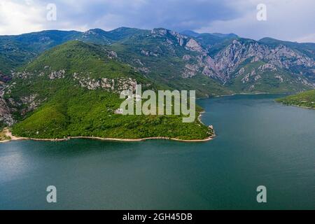 Aerial view of a Vau Dejes reservoir on Drin river, with a hydroelectric dam on it. The beautiful landscape around the lake in Albania Stock Photo