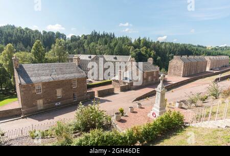 The war memorial at New Lanark 18th century mill village, a UNESCO World Heritage Site, in Lanarkshire, Scotland, UK Stock Photo