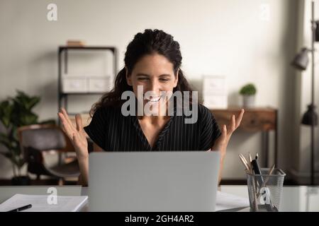 Happy excited businesswoman surprised and overjoyed with good news Stock Photo