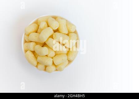 sweet corn sticks in bowl with ampty space for text isolated on white background, top view Stock Photo