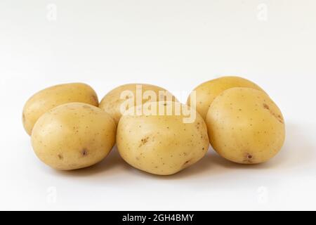 pile of fresh raw potatoes isolated on white background, raw vegetables, harvest new of white potatoes, side view Stock Photo