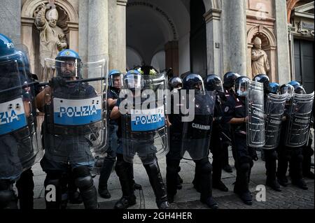 Milan, Italy - September 5, 2021: Italian Police officers in full riot gear during a protest against the mandatory health pass Stock Photo