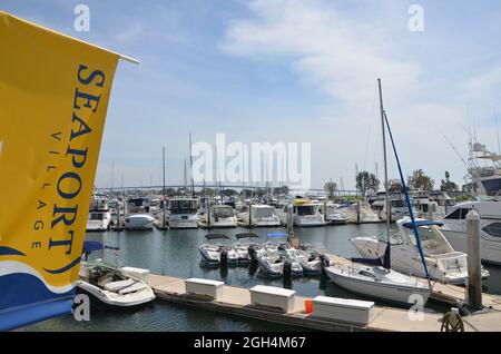 Landscape with scenic view of luxury yachts and sailing boats at the San Diego Bay Seaport Village marina in California USA. Stock Photo
