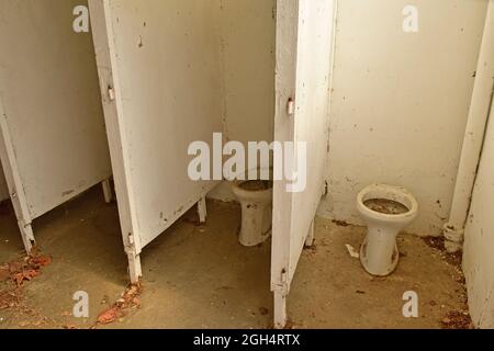 Ruined toilet and restroom of an old building Stock Photo