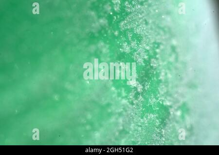 frig snow on green bottle with selective focus Stock Photo