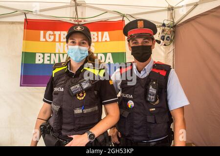 Barcelona, Catalonia, Spain. 4th Sep, 2021. Policemen are seen in fair tent.Fair of LGTBI   entities, in the pride of Barcelona 2021, which has been held under the theme ''together against the stigma of HIV'', on a rescheduled date that Saturday, September 4, without festive or musical activities due to the incidence of the pandemic of Covid-19. (Credit Image: © Thiago Prudencio/DAX via ZUMA Press Wire) Stock Photo