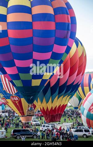 Colorful hot air balloons and crowd, Albuquerque International Balloon Fiesta, Albuquerque, New Mexico USA Stock Photo