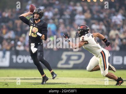 West Lafayette, Indiana, USA. 04th Sep, 2021. Purdue quarterback Jack Plummer (13) passes the ball as Oregon State linebacker Andrzej Hughes-Murray (2) pursues during NCAA football game action between the Oregon State Beavers and the Purdue Boilermakers at Ross-Ade Stadium in West Lafayette, Indiana. Purdue defeated Oregon State 30-21. John Mersits/CSM/Alamy Live News Stock Photo