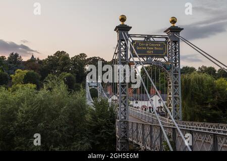 Queens Park suspension bridge seen over the River Dee in Chester Stock ...