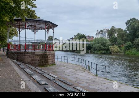 Bandstand on the side of River Dee at Chester as the Queens Bridge occupies the background. Stock Photo