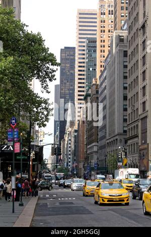 New York - August 3, 2017, Yellow taxi cabs ride on 5th Avenue in New York City, USA Stock Photo