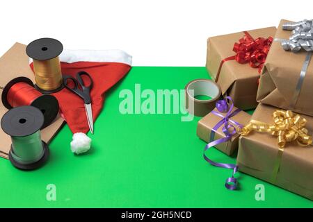 View of gifts packed in holiday boxes lying on the desktop. Christmas holiday concept. Postcard. Sweden. Stock Photo