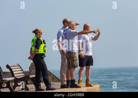 Sandbanks, Poole, Dorset UK. 5th September 2021. Preparation work gets underway to lift the plane that ditched into the sea at Sandbanks during yesterdays display by The AeroSuperBatics Wingwalkers during the Bournemouth Air Festival. Divers observe the scene. Credit: Carolyn Jenkins/Alamy Live News Stock Photo