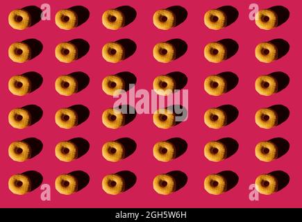 Top view of background of classic donuts without cover on pink background Stock Photo