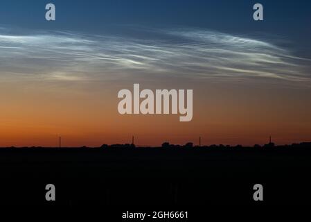 Detailed image of noctilucent clouds (NLC) in the northern sky on an evening in June Stock Photo
