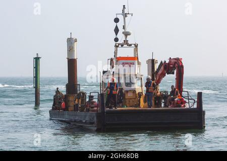 Sandbanks, Poole, Dorset UK. 5th September 2021. Preparation work gets underway to lift the plane that ditched into the sea at Sandbanks during yesterdays display by The AeroSuperBatics Wingwalkers during the Bournemouth Air Festival. Credit: Carolyn Jenkins/Alamy Live News Stock Photo