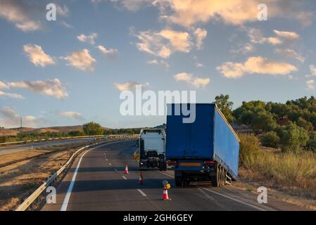 Semi-trailer uncoupled from the truck while driving, causing an accident. Stock Photo