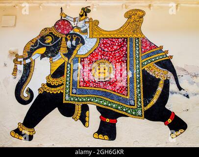 Stunning fresco with elephant finely decorated with traditional Indian ornaments and fabrics, City Palace, Udaipur, Rajasthan, India Stock Photo