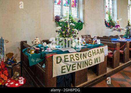 Display by Dersingham Women's Institute in St Nicholas' church, as part of the Dersingham Open Gardens day. Stock Photo