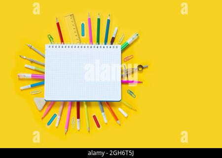 School suplies on yellow background Stock Photo