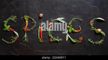 Spices written of various herbs and spices Stock Photo