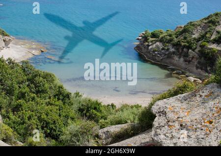 Shadow of airplane over the sea. Travel and beach vacation concept. Travel freedom concept. Stock Photo