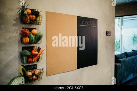 Vintage interior design of kitchen space with table on a shadow gray concrete stylish wall background. Concept of kitchen space on country side. Natur Stock Photo