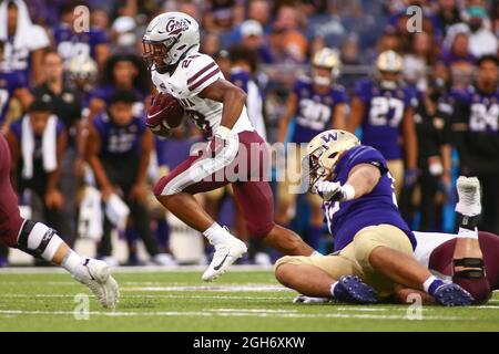 Seattle, WA, USA. 4th Sep, 2021. Montana Grizzlies running back Isiah Childs (28) runs the ball past Huskies defenders during a game between the Montana Grizzlies and Washington Huskies at Husky Stadium in Seattle, WA. The Grizzlies defeated the Huskies 13-7. Sean Brown/CSM/Alamy Live News Stock Photo