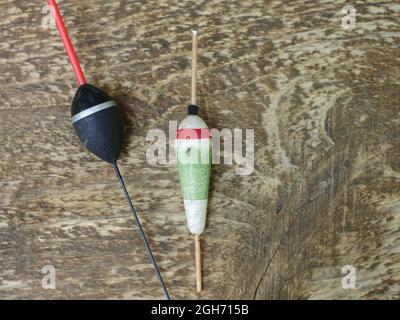 old fishing bobber on wooden texture still life Stock Photo