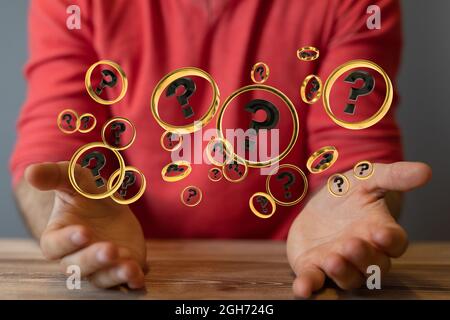 A digital concept of businessman solving problems, floating question marks in the hands Stock Photo