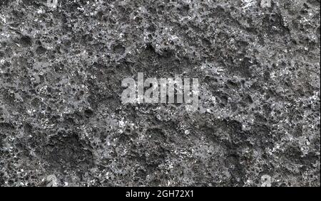 Vintage background from dark stone texture. Black stone texture in macro style. Stock Photo