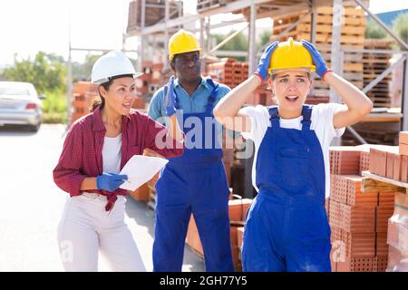 Workers have problems at work at a hardware store Stock Photo