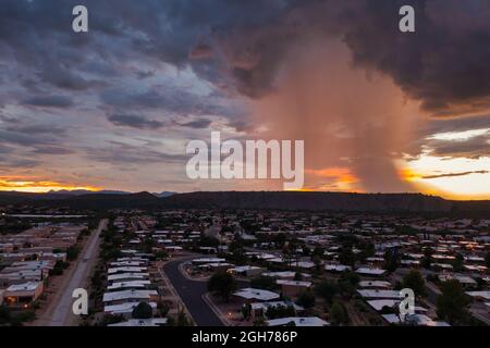 Monsoon rain over houses in Green Valley, Arizona Stock Photo